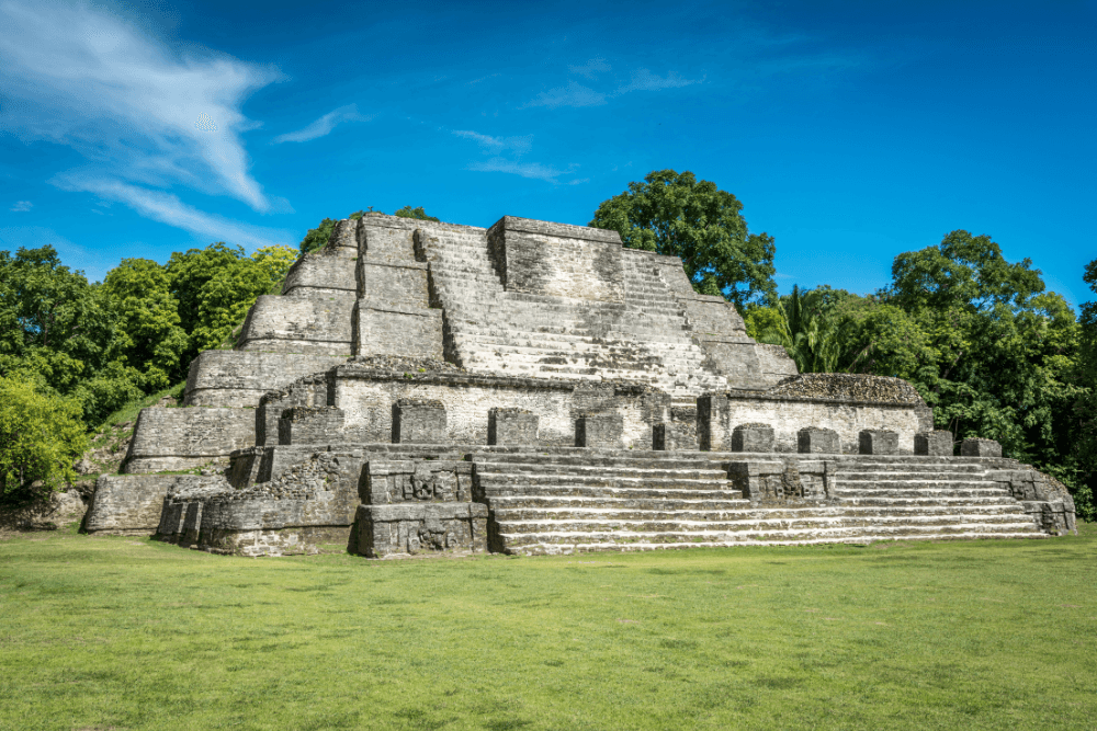 Mayan temple with green trees and green grass